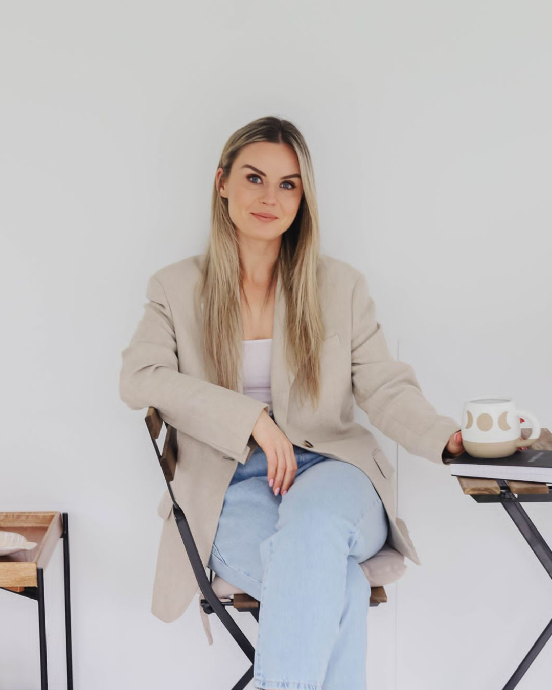 Robyn Taaffe, nurse and founder of Whole Self Medicine, seated in a blazer